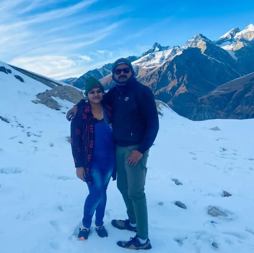 Holiday Globe travellers together in a snowy mountain landscape